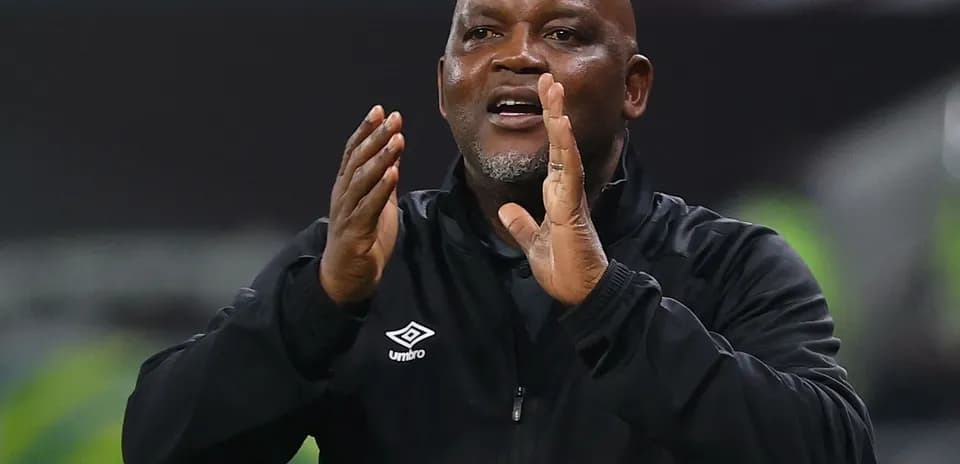 Coach gesturing and giving instructions during match