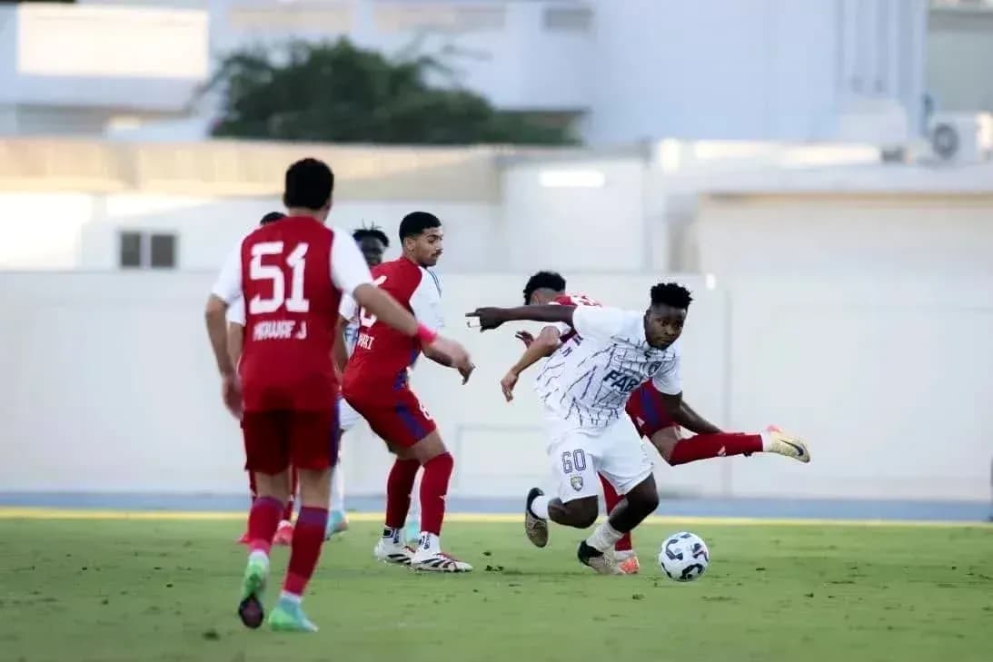 Player dribbling the ball during U23 football match