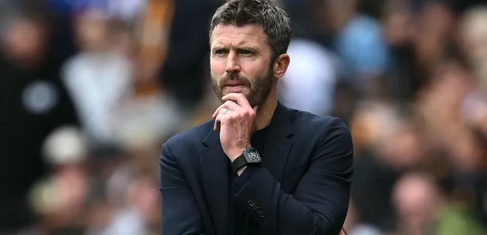 Manager contemplating during a match on the sideline