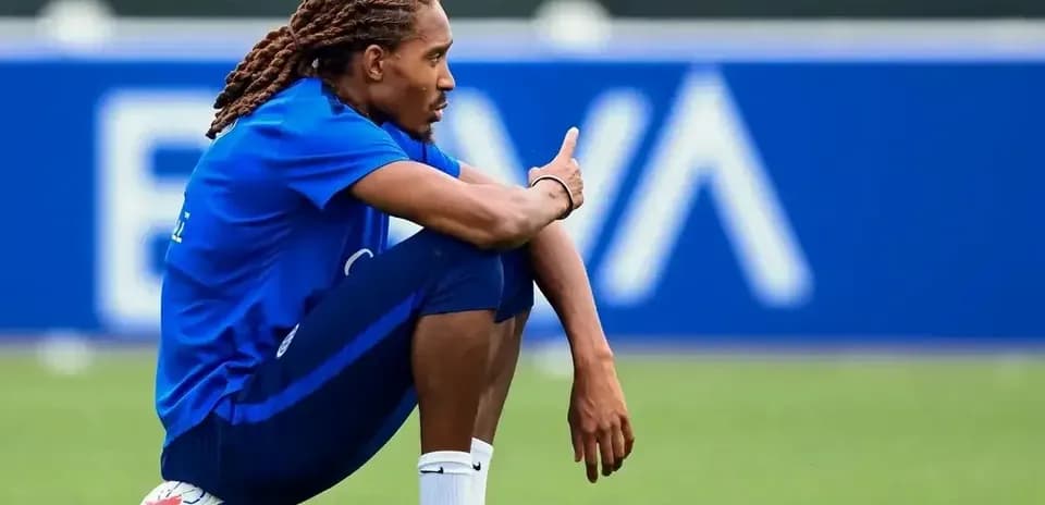 Player sitting on ball during training session