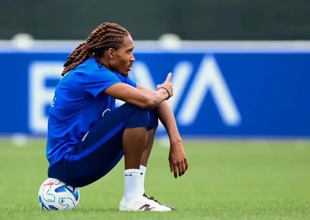 Player sitting on ball during training session