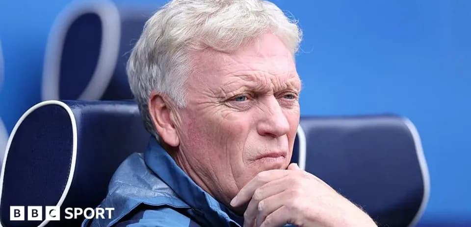 Coach sitting on the bench during a match