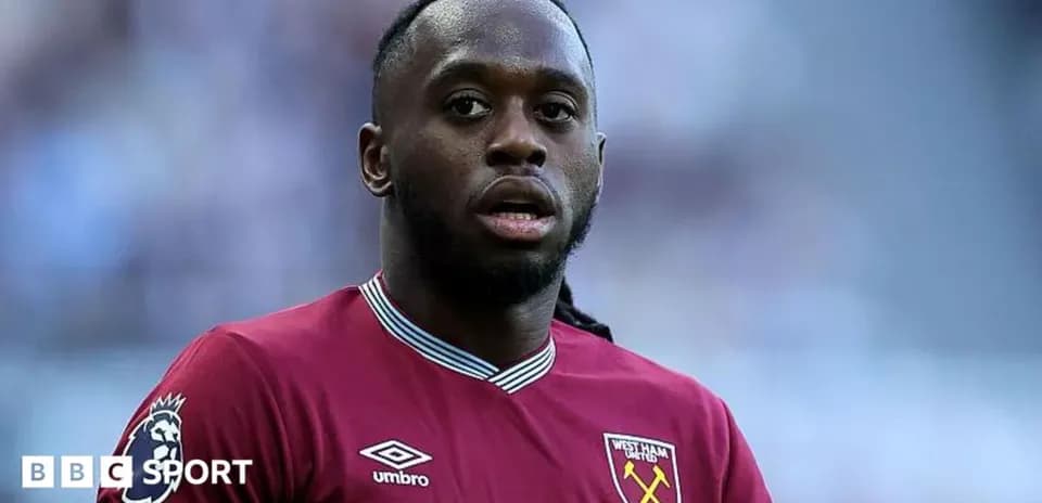 West Ham player in maroon jersey on field