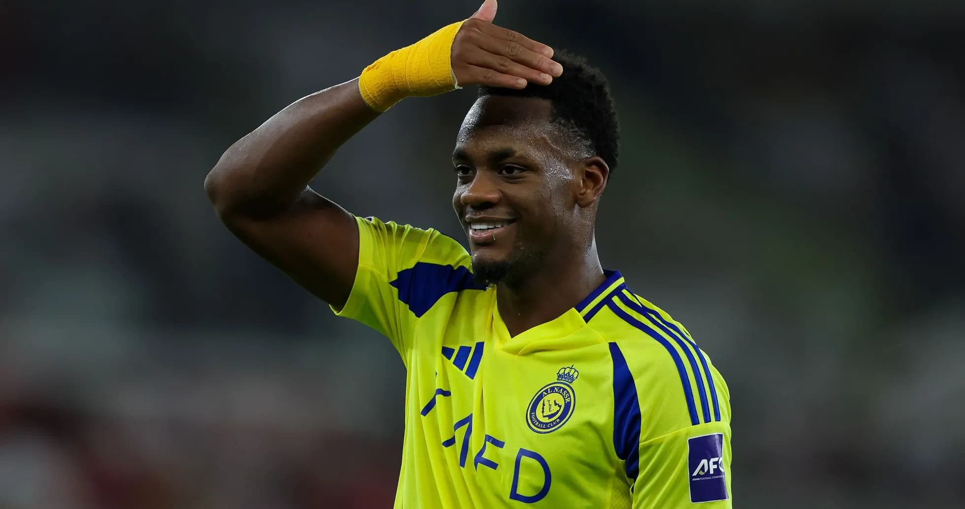 Player celebrating with a hand gesture during match