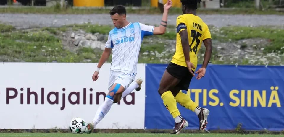 Universitatea Craiova player kicking the ball