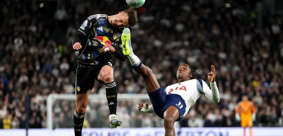 Goalkeeper and player collide during football match