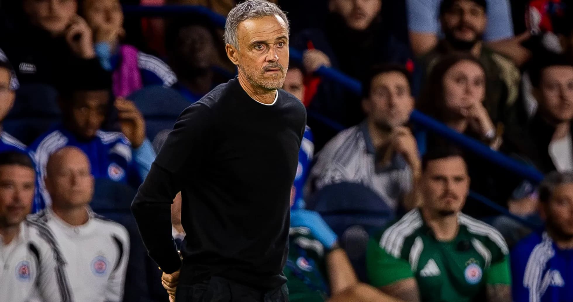 Manager observing the game from the sidelines