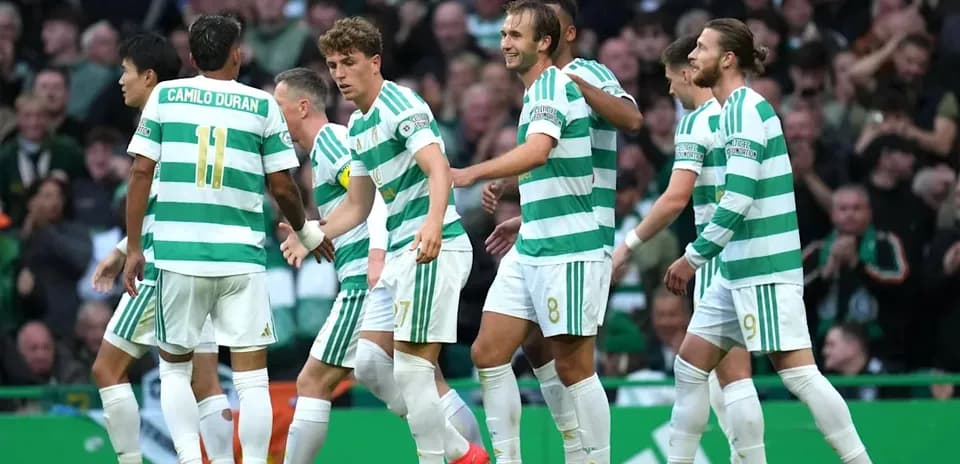 Celtic players celebrating a goal on the field
