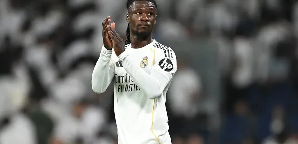 Player applauding fans at stadium after match