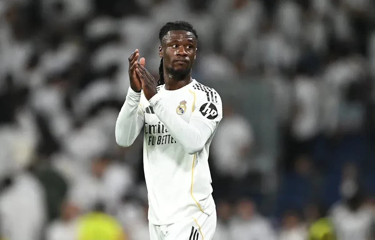 Player applauding fans at stadium after match