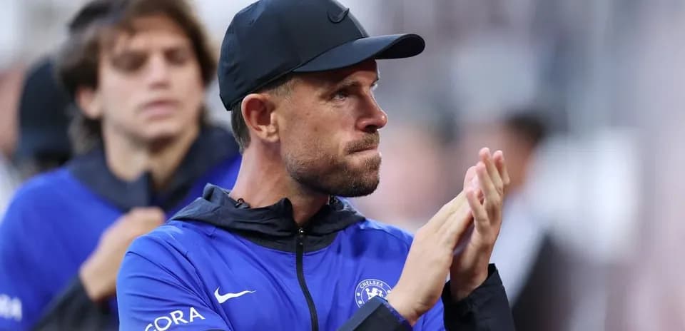 Coach applauding from the sidelines during match