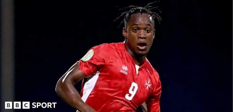 Player in red jersey during football match