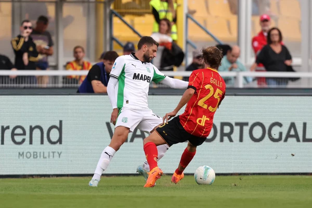 Sassuolo player challenges Lecce opponent during match