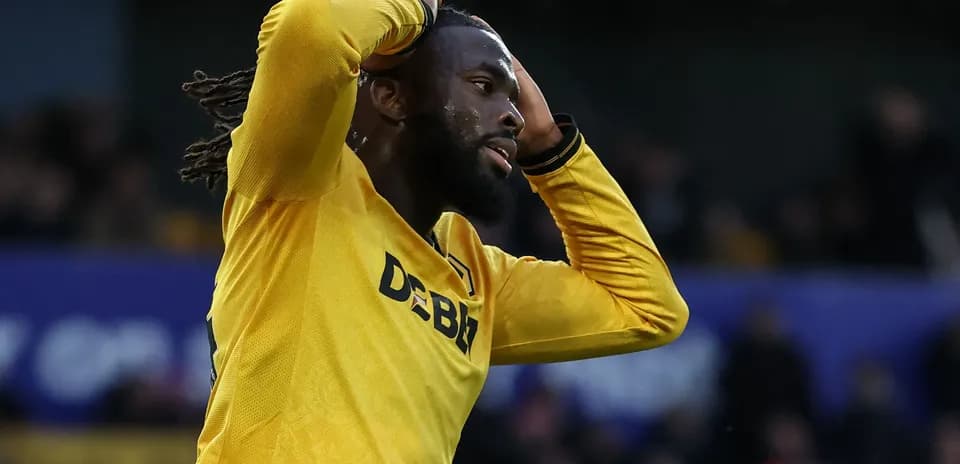 Player in yellow jersey expressing frustration during match