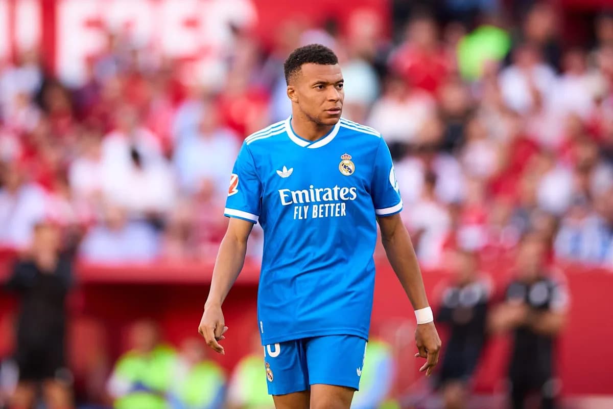 Player in blue Real Madrid kit on the pitch
