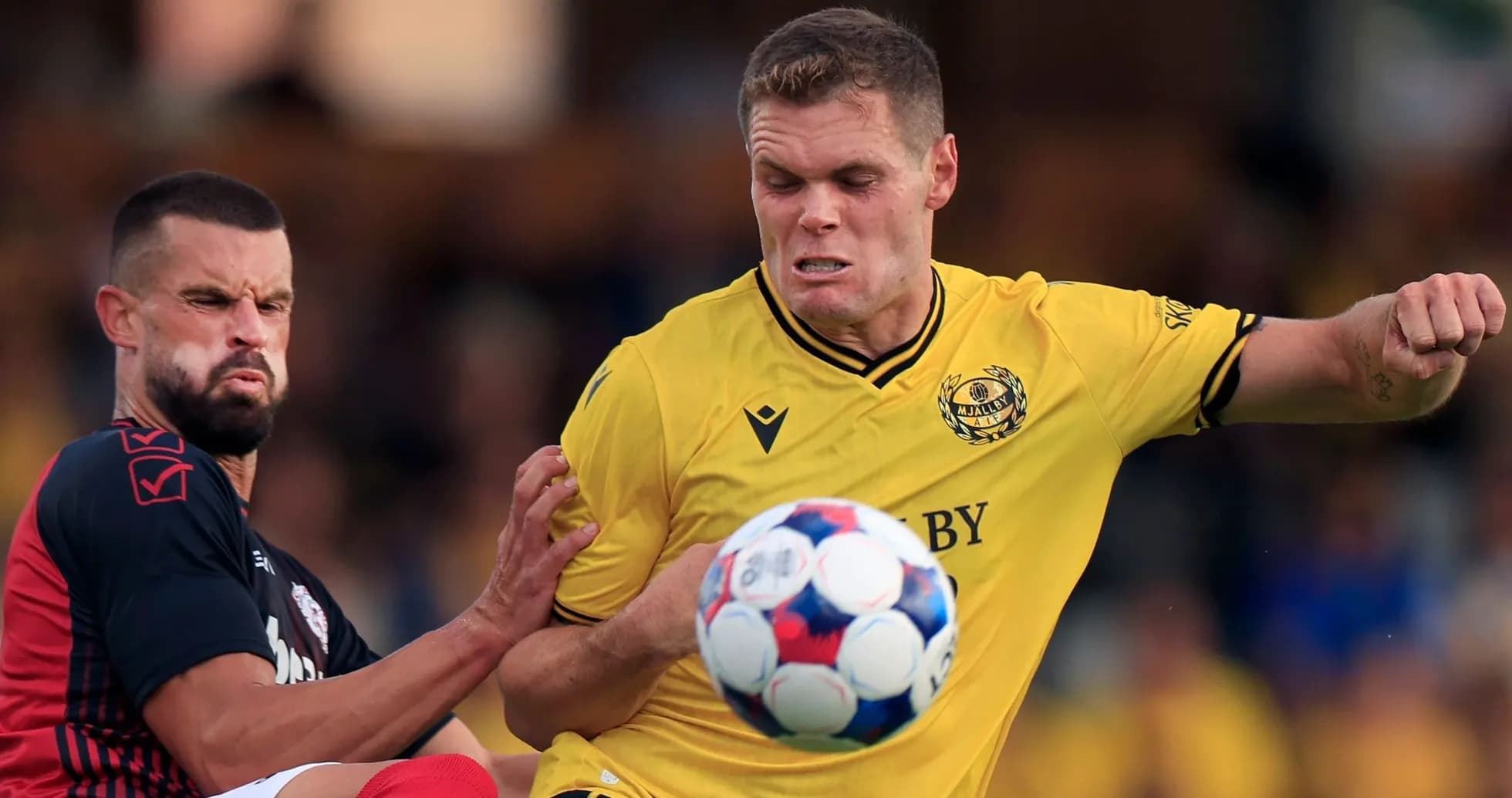 Mjallby player battling for ball during match