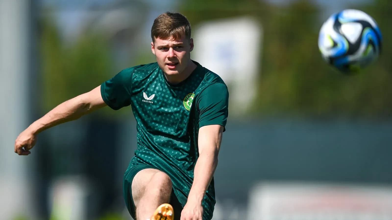 Player kicking a football during training session