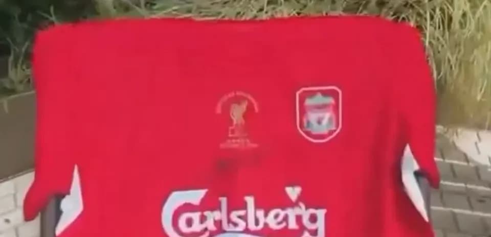 Red Liverpool jersey displayed outdoors