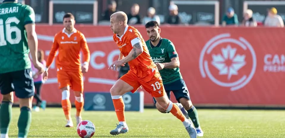 Player running with ball during York United match