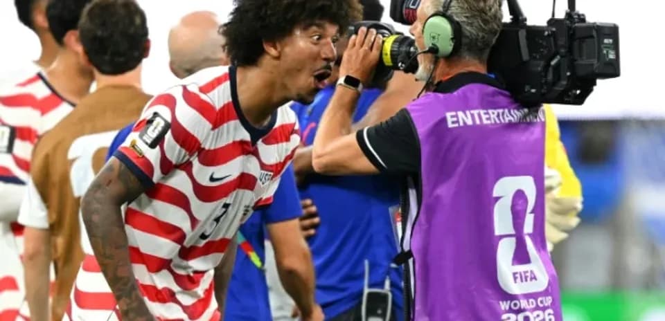 US player celebrating and speaking to camera operator