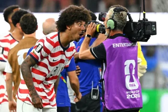 US player celebrating and speaking to camera operator