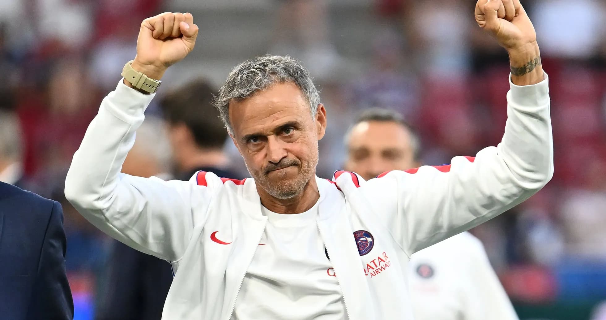 Coach celebrating with raised fists after match