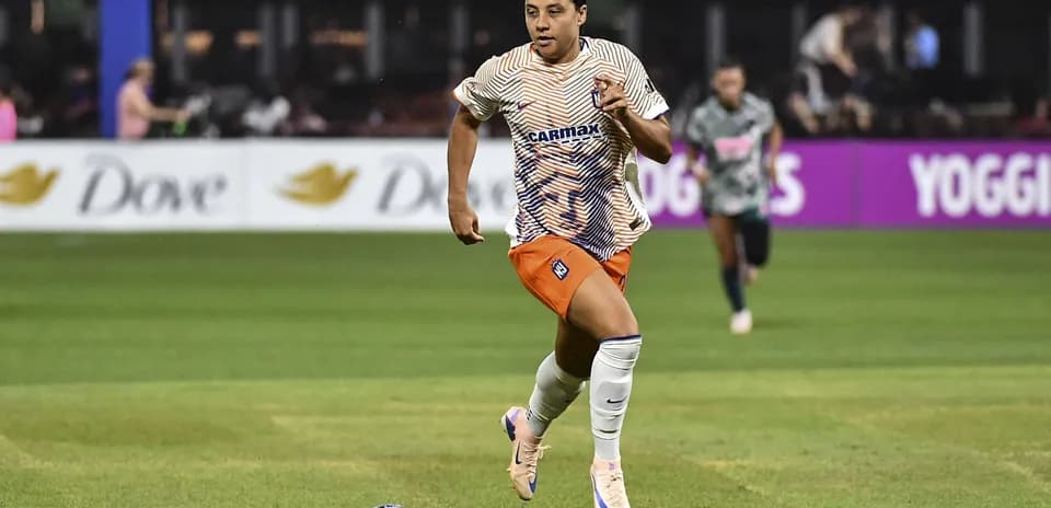 Player running with ball during soccer match
