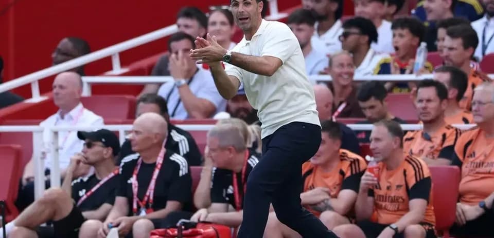 Manager instructing players from the sidelines during match