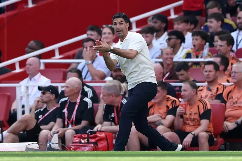 Manager instructing players from the sidelines during match