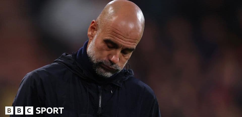 Coach with head down during match