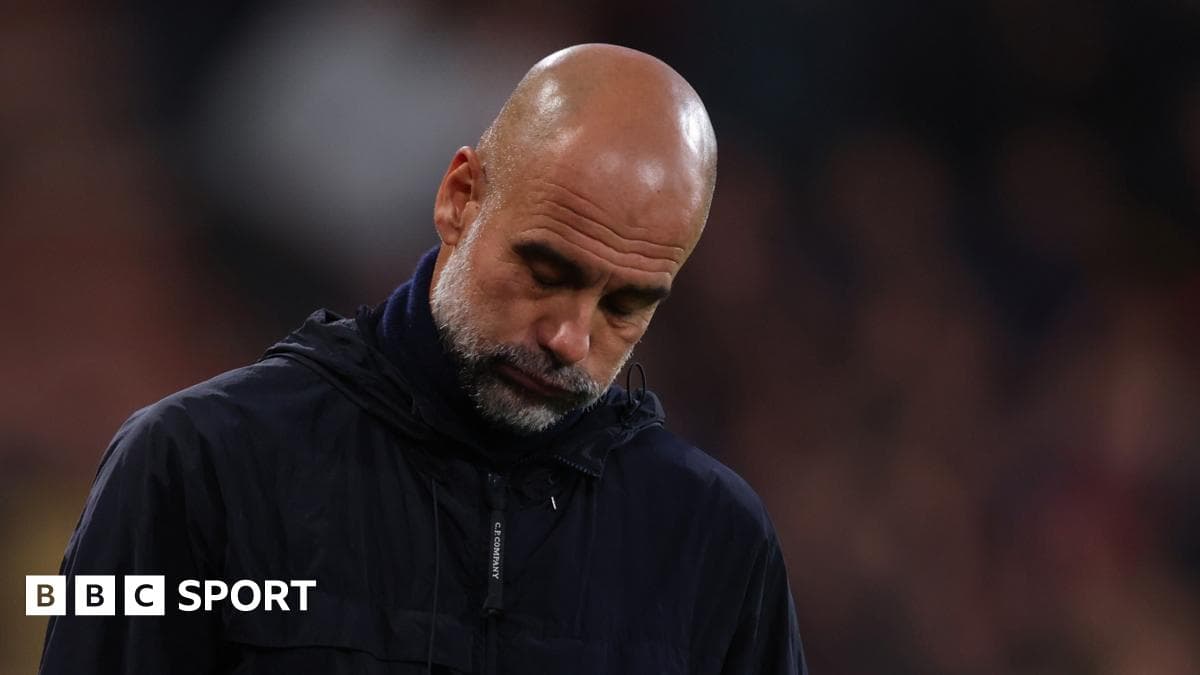 Coach with head down during match
