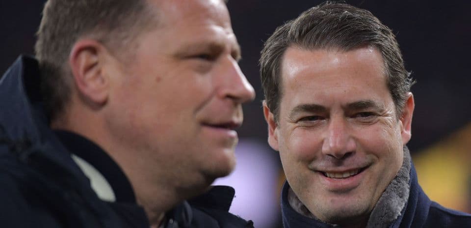 Two men talking during a sports event
