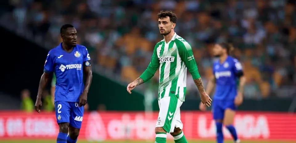 Two players on the field during a football match