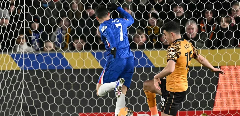 Chelsea player attempts to score against Hull City
