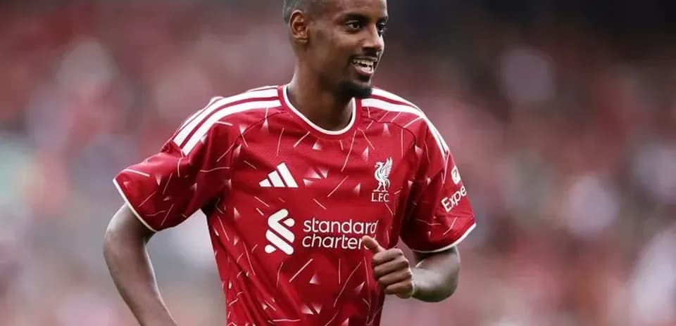 Player celebrating in Liverpool FC home kit