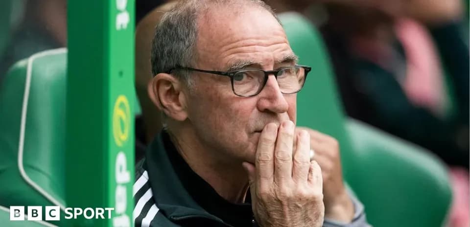 Coach observing from the sidelines during match