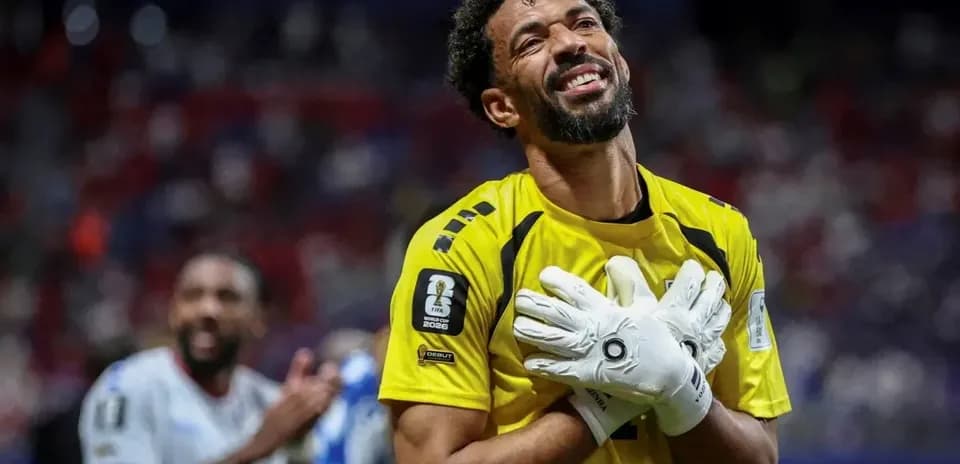 Goalkeeper celebrating with hands on chest