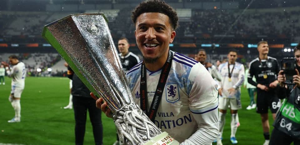 Player celebrating with trophy after winning final