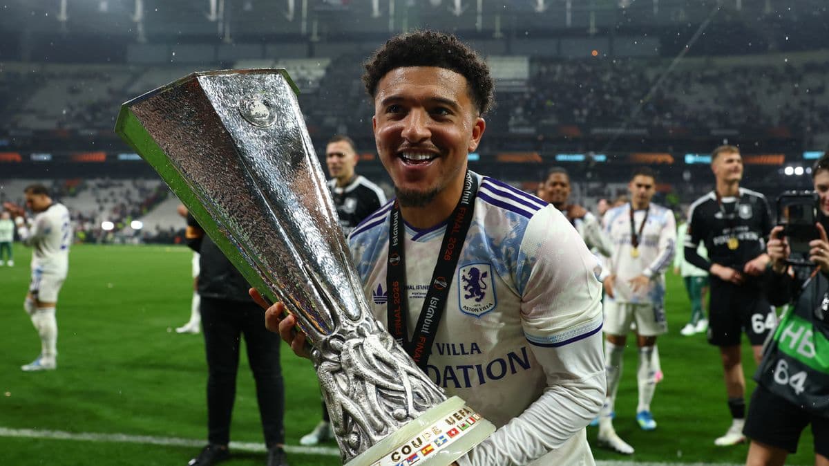Player celebrating with trophy after winning final