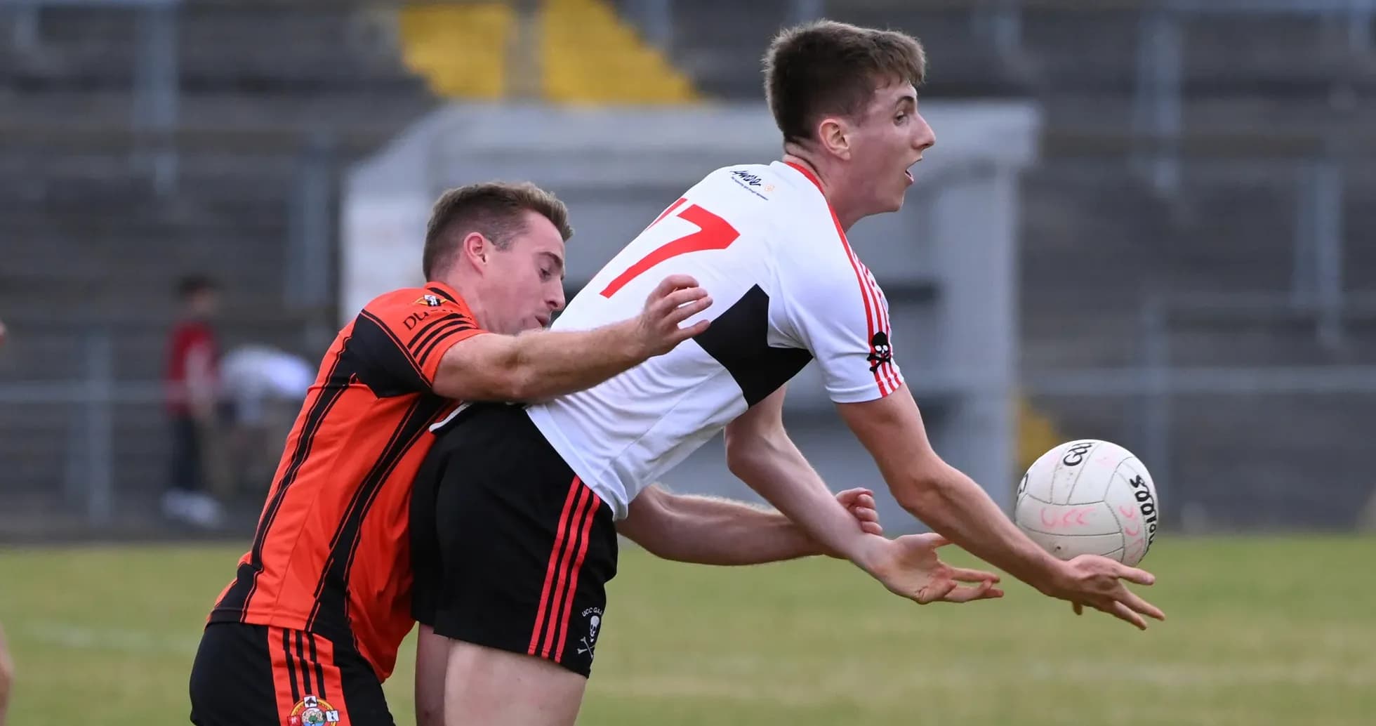 Two players competing for possession of the ball