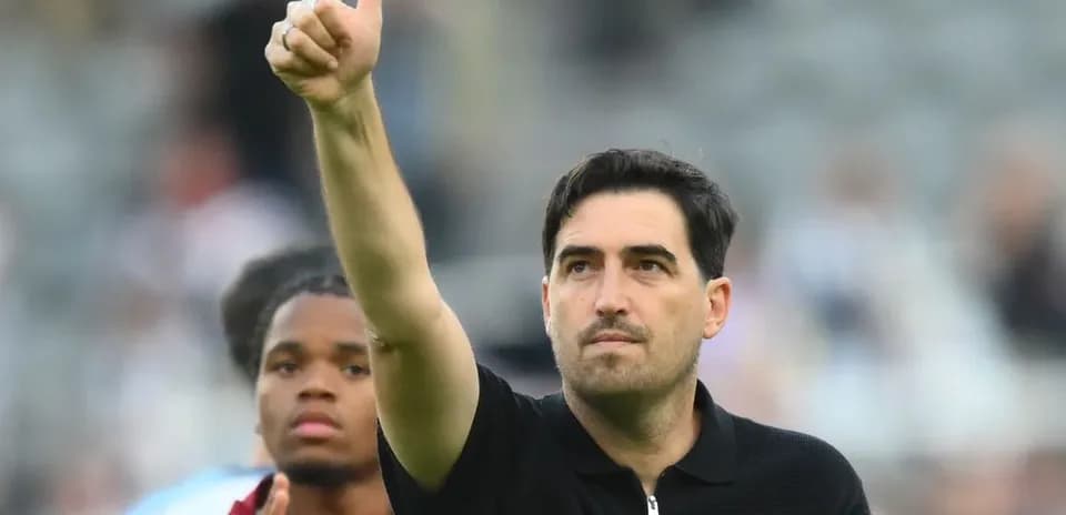 Coach giving a thumbs up after the match