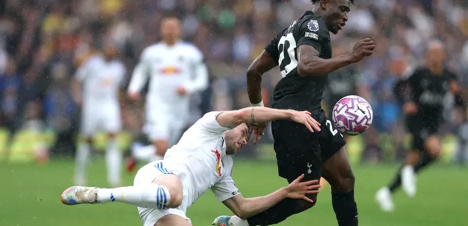 Player tackling opponent during a football match