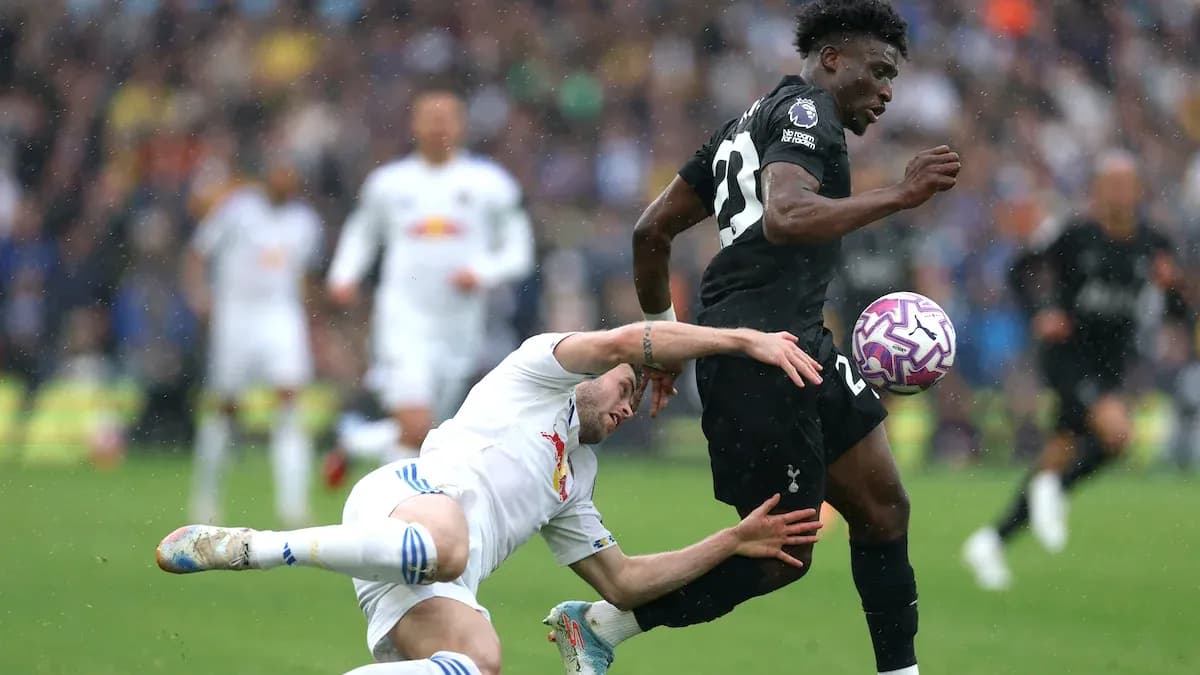 Player tackling opponent during a football match