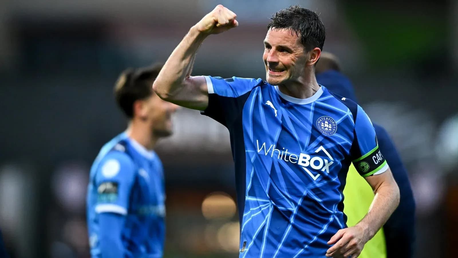 Player celebrating victory with raised fist