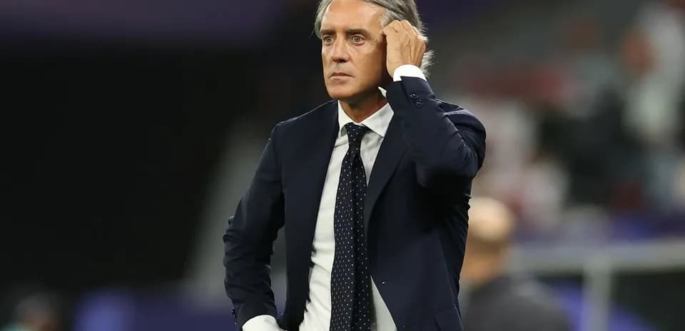 Coach observing the match from the sidelines