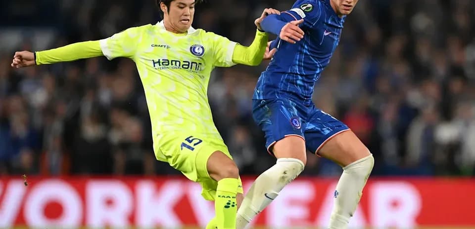 Two players contesting for the ball during match