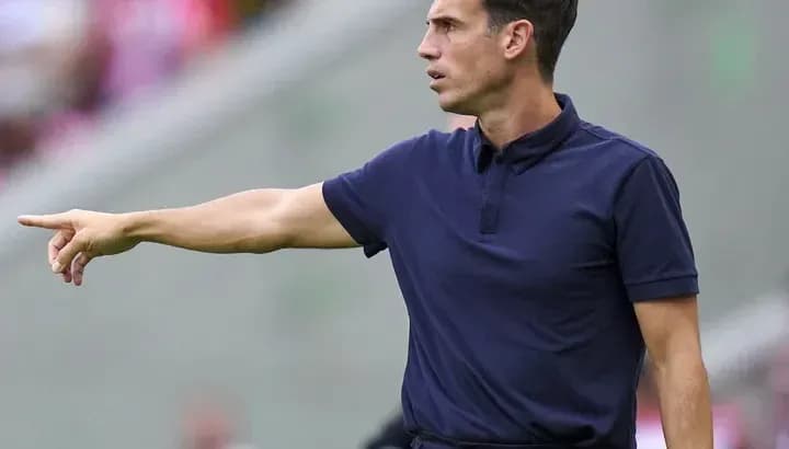 Coach giving instructions from the sidelines