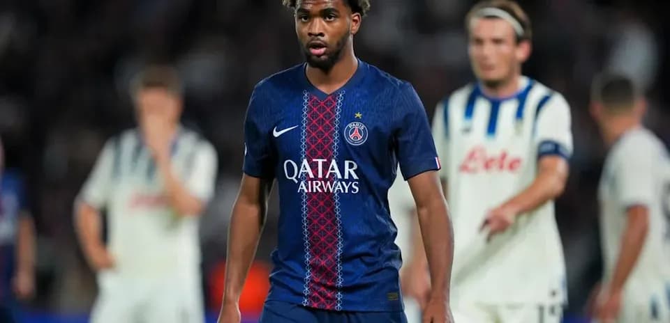 PSG player walking on field during match