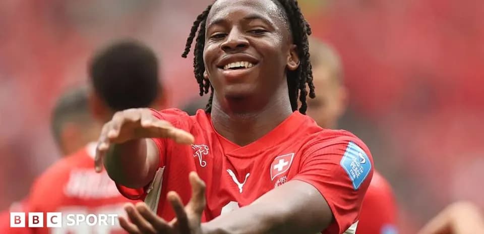Player celebrating in red Swiss national team jersey