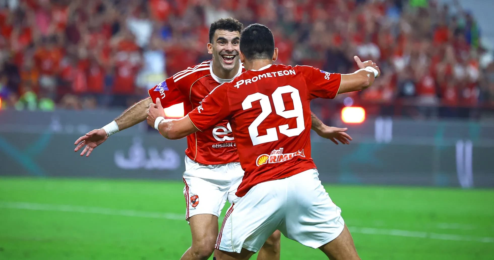 Players celebrating a goal during a match